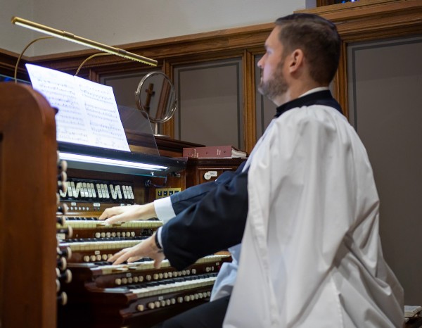 Brennan playing organ