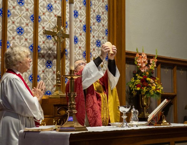 Eucharist with host lifted