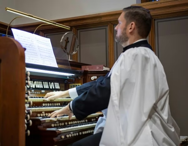 Brennan playing organ